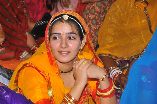 Bindhani customer wearing rakhadi in rajasthani sangeet event in blue rajasthani dresses