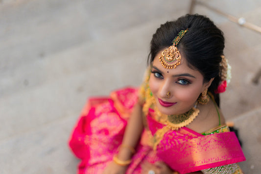 Indian-women-in-south-indian-temple-maang-tikka-with--wedding-silk-sarees