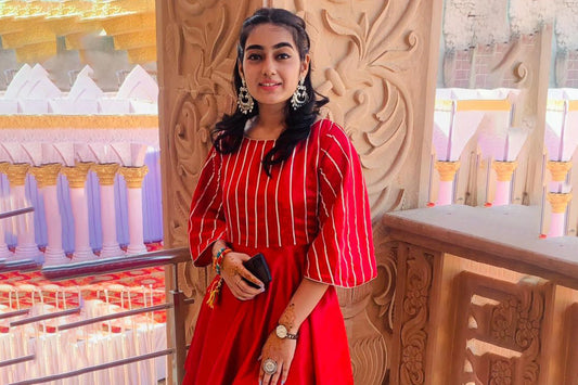 college-girl-wear-long-oxidised-earrings-red-lahariya-kurta-matching-dhoti-finger-ring