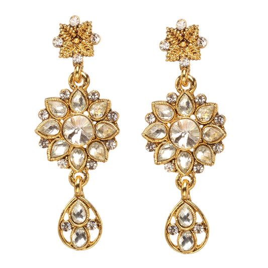 Bindhani gold-plated floral drop earrings featuring a flower-shaped design with sparkling white stones, intricate gold detailing, a central round stone, and an elegant teardrop hanging charm. Traditional bridal earrings with a luxurious stone-studded finish, displayed on a white background.