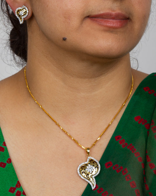 Elegant Bindhani traditional cubic zirconia stone jewelry set featuring a gold-finish pendant necklace with sparkling white stones and intricate floral paisley craftsmanship. Paired with matching designer stud earrings, this ethnic jewelry set complements sarees, salwar suits, and festive wear perfectly.