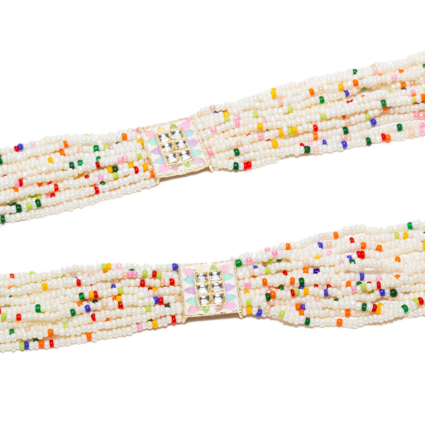 Close-up view of the long Bindhani-style rani haar necklace strands featuring multiple rows of white seed beads accented with tiny multicolor beads. Decorative square kundan connectors with pastel enamel detailing in pink, mint green, and lavender join the layered strands, highlighting the handcrafted traditional design.