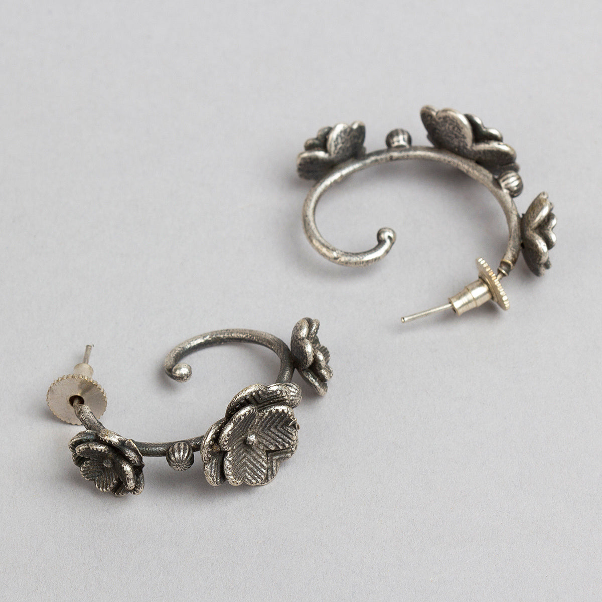 bindhani silver toned flower shaped earrings for women girls