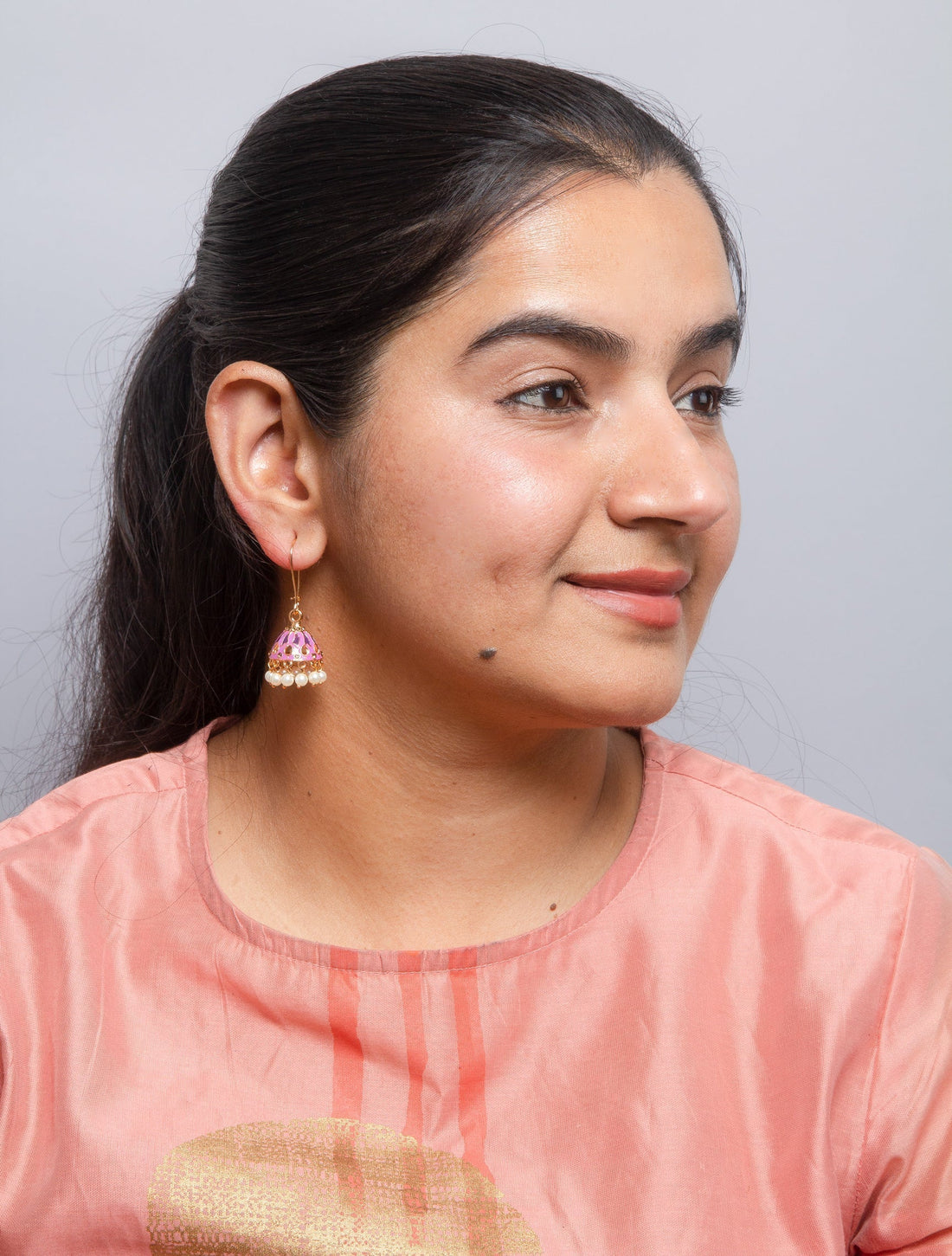 Bindhani bell shaped pink meenakari jhumki.