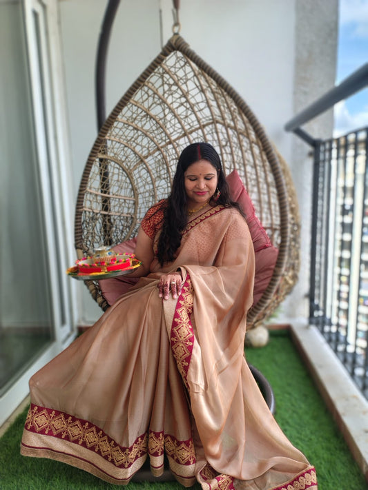 Lady sitting in red Bindhani earring with Karwachuth get up