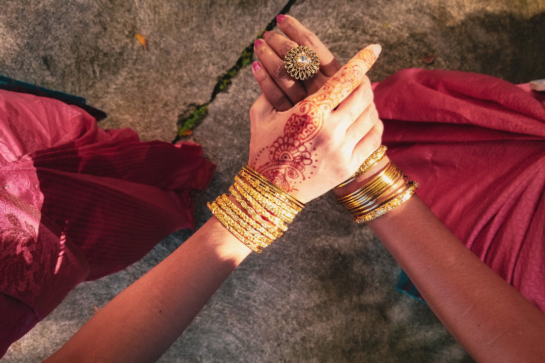 Ladies-showing-gold-plated-metal-bangle-bracelets