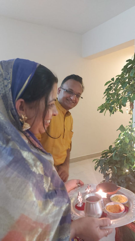Little ganesh in earlobes of a indian lady Bindhani earrings