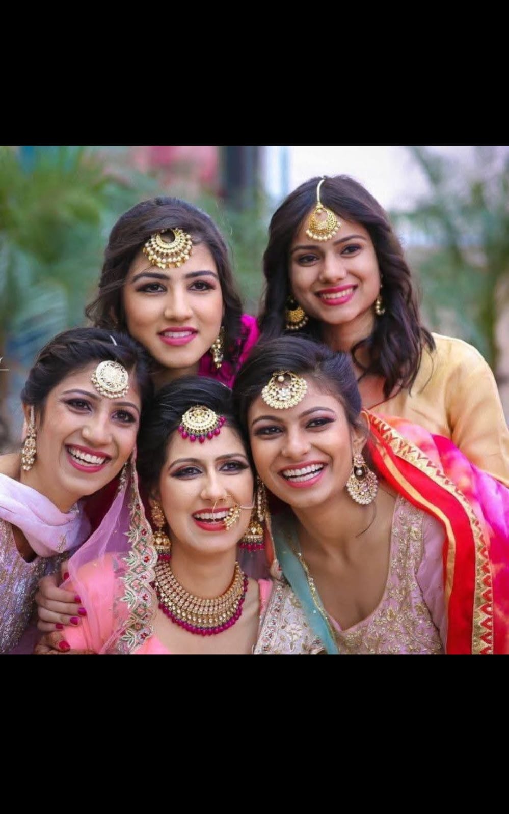 A troop of bride holding tika as statement jewellaryewelry