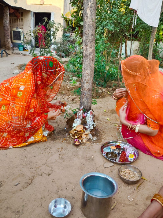 Two Bindhanis (women) sitting for puja ritual _Bindhani