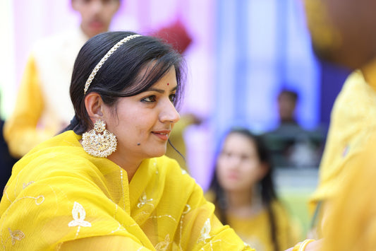 bindhani customer with chandbali pearl earrings for her haldi function in wedding