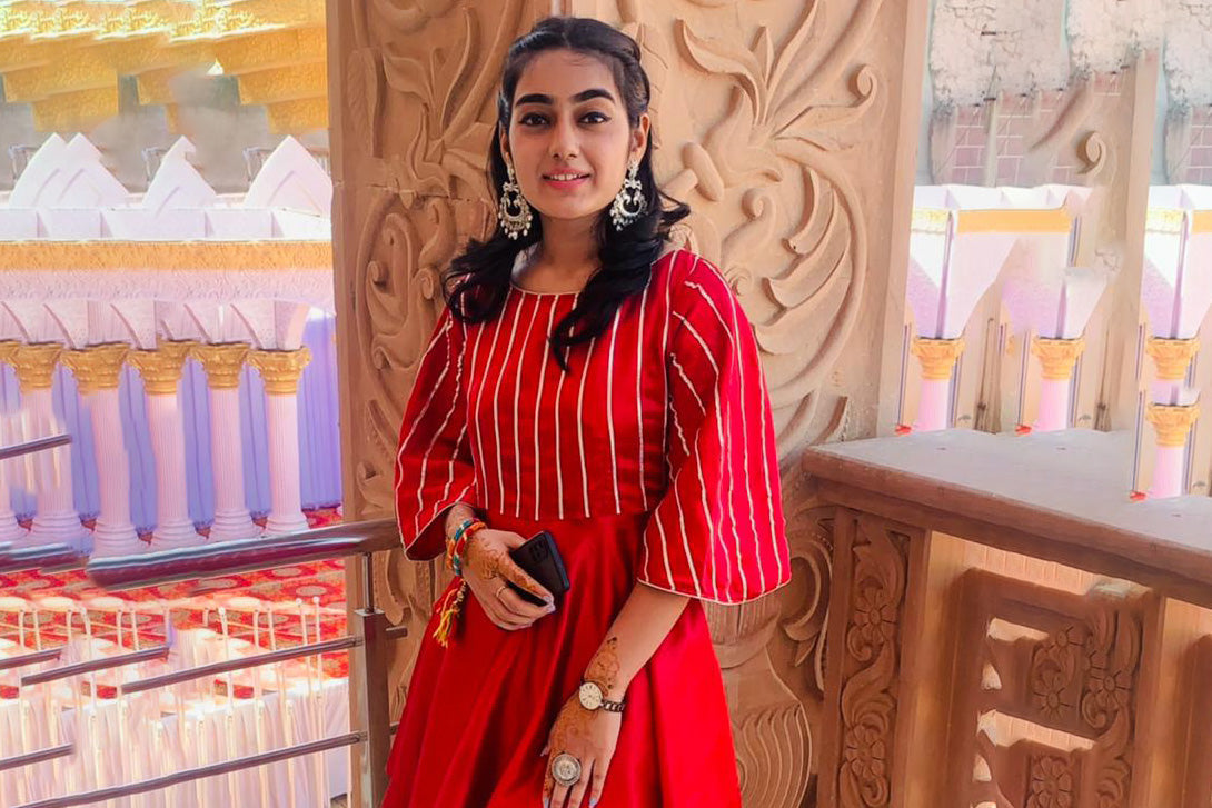 college-girl-wear-long-oxidised-earrings-red-lahariya-kurta-matching-dhoti-finger-ring