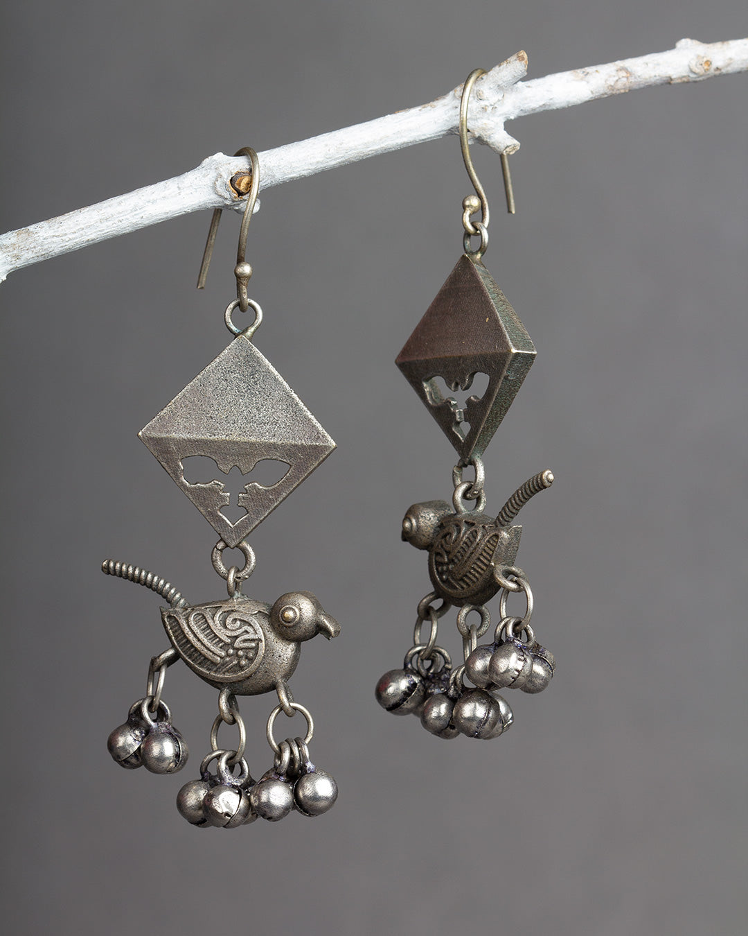 Bindhani silver replica silver look alike earrings in theme of nature, bird or purpose