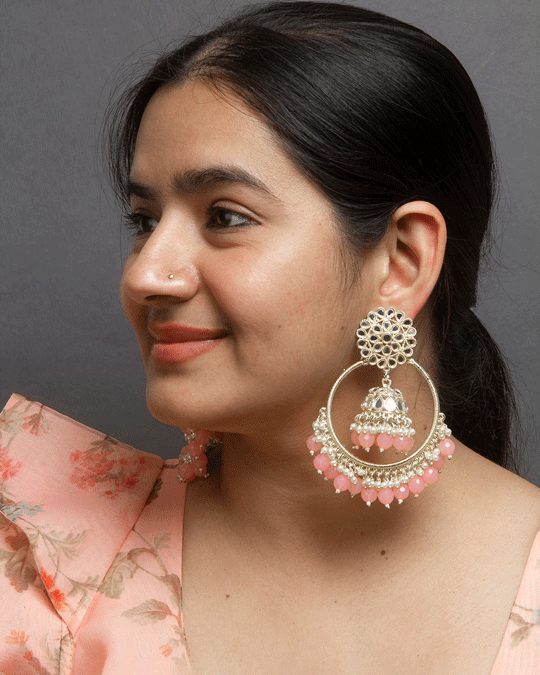 Bindhani model wearing gold-plated pearl earrings for women