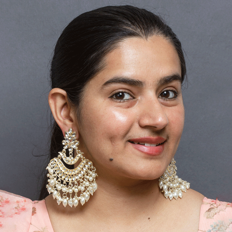 Bindhani model wearing traditional pearl earrings for women