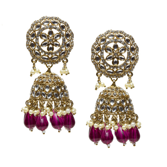 A highly ornate pair of Bindhani antique mehndi gold-plated jhumka earrings featuring large circular lattice-style stud tops embellished with concentric floral motifs and clear Kundan-style stones set in intricate gold filigree. The design includes detailed dome-shaped jhumkas with layered patterns of teardrop-shaped stone settings and fine metalwork. The earrings are finished with multiple tiers of dangling white pearl drops and elongated translucent purple  bead drops at the base, creating a rich contra