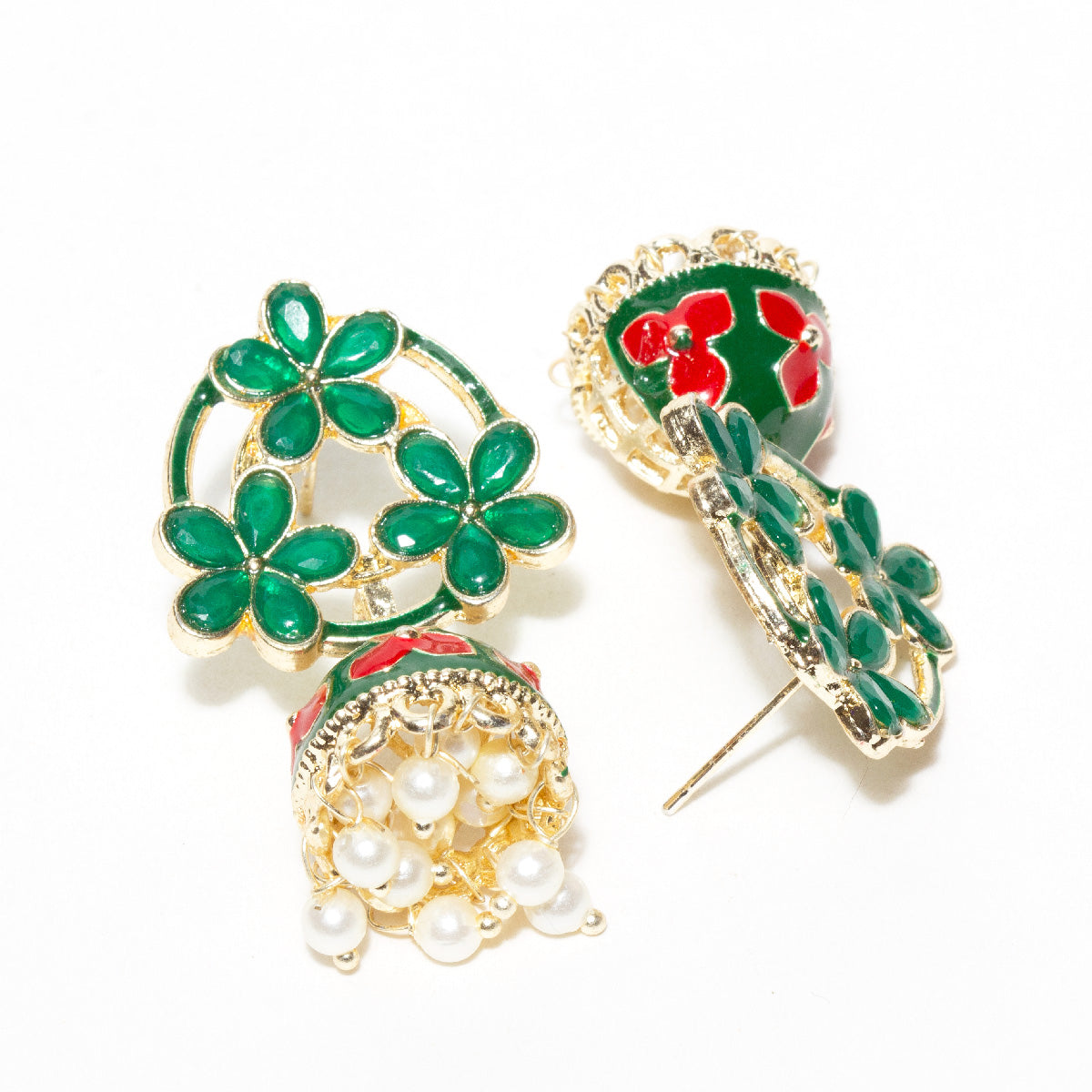 Pair of gold-tone floral jhumka earrings featuring Green red petal-shaped stones in an open floral pattern, accented with green red enamel detailing and pastel red flower motifs on the dome. Finished with intricate gold filigree work and dangling white pearl beads for a traditional festive look. front and back view secure post string details
