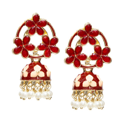 Pair of gold-tone floral jhumka earrings featuring maroon with cream petal-shaped stones in an open floral pattern, accented with maroon white enamel detailing and white flower motifs on the dome. Finished with intricate gold filigree work and dangling white pearl beads for a traditional festive look.