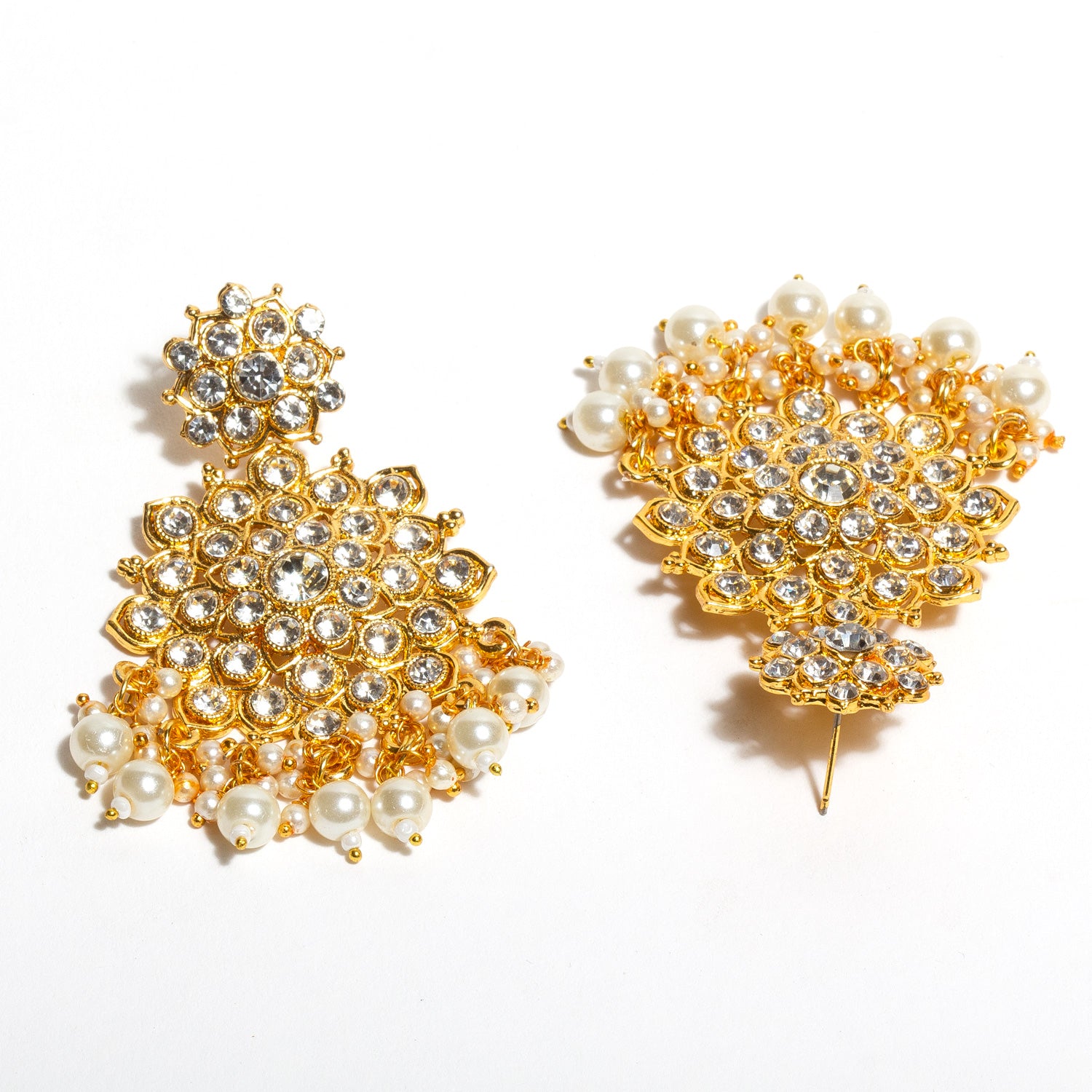 Detailed view of Bindhani gold-plated traditional earrings for women, showing intricate design with sparkling white stones and a dangling pearl drop.