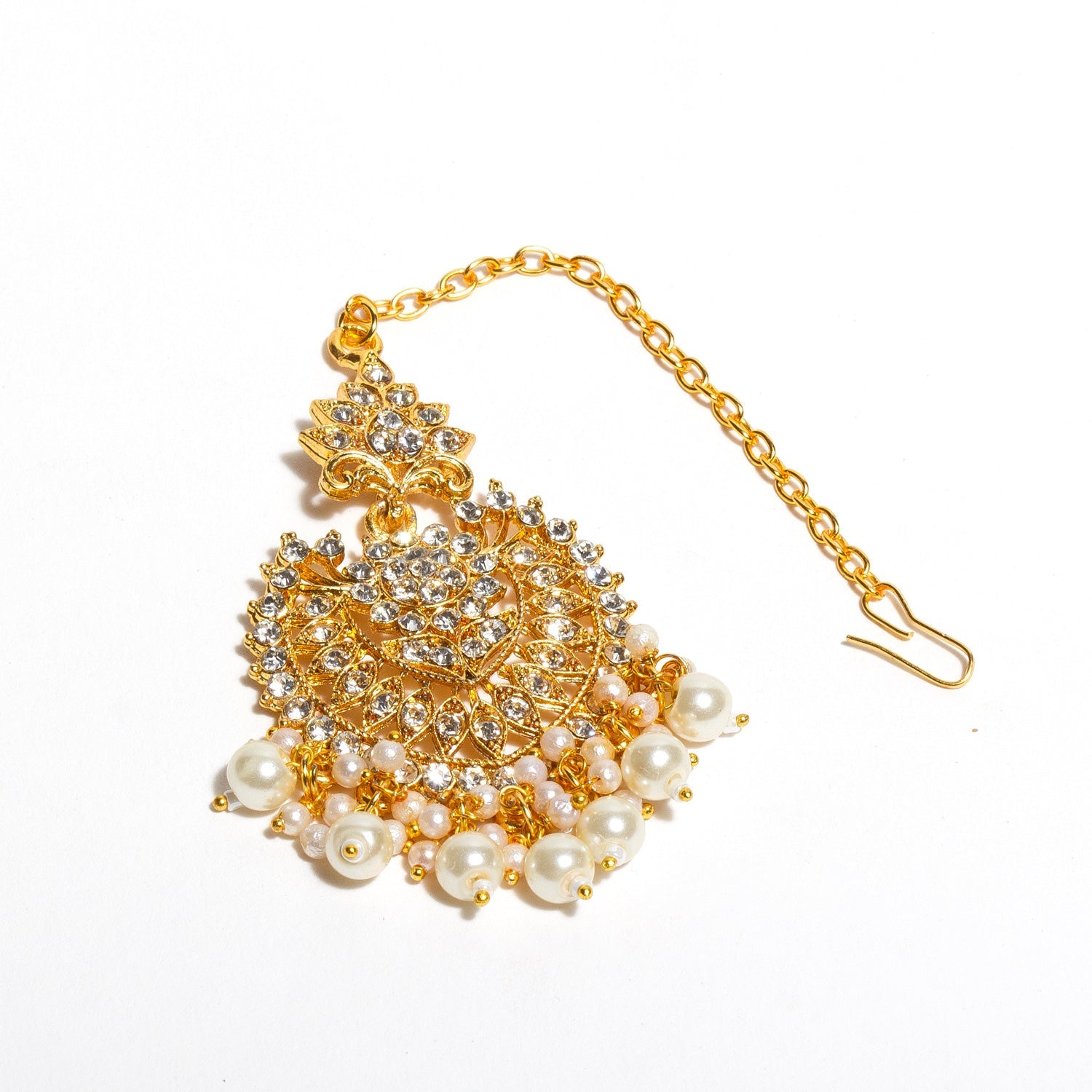 Bindhani gold-plated traditional Indian hair accessory with intricate detailing, decorated with sparkling white stones and dangling white pearls, featuring a gold chain with hook.