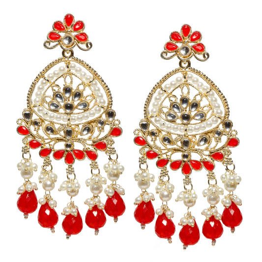Front view of a pair of traditional Bindhani gold-plated chandbali earrings featuring a floral stud with six red petals surrounding a round style Kundan stone. The large crescent-shaped chandbali is adorned with intricate gold filigree, teardrop-shaped Kundan stones, and a double border of white faux pearls. The lower section is decorated with red petal motifs and additional white kundna stones. Five dangling clusters of white faux pearls end with faceted red teardrop beads,