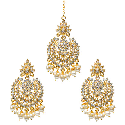 Bindhani gold-plated traditional Indian earrings tikka set  featuring an intricate ethnic design adorned with sparkling white stone detailing and elegant dangling pearl drop accents.showcase fine craftsmanship and a festive traditional style suitable for cultural and special occasions.