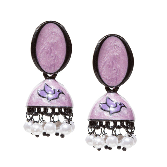 Pair of traditional purple jhumka earrings featuring a glossy enamel-like finish with a black-bordered oval stud top. Each earring has a domed bell-shaped base decorated with a purple enamel bird motif outlined in black, adding a vibrant decorative accent. The lower edge is finished with evenly spaced white pearl-like bead danglers attached using black metal loops, creating a delicate hanging effect and gentle movement. The overall design combines bold color contrasts with traditional jhumka craftsmanship,