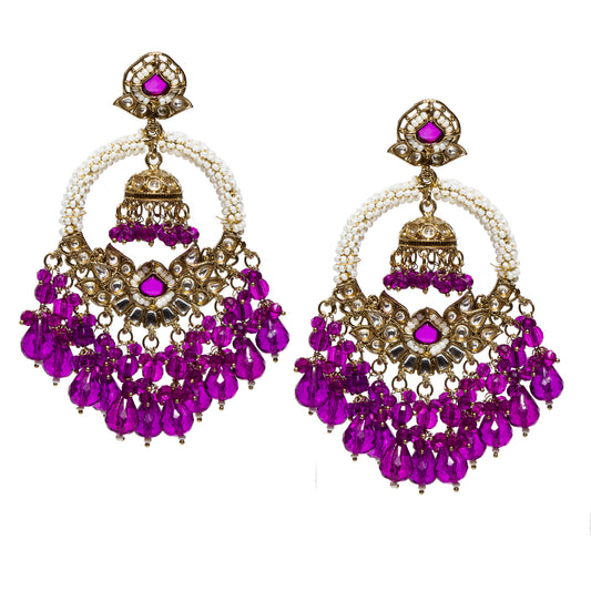 Bindhani antique gold-plated hoop jhumka earrings featuring a pearl-wrapped circular hoop with purple stone accents and intricate Kundan detailing. The center showcases an ornate floral-inspired design with a matching mini jhumka drop, while cascading faceted purple teardrop beads create a graceful fringe. Traditional statement earrings displayed as a pair on a white background.