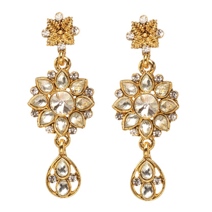 Bindhani gold-plated floral drop earrings featuring a flower-shaped design with sparkling white stones, intricate gold detailing, a central round stone, and an elegant teardrop hanging charm. Traditional bridal earrings with a luxurious stone-studded finish, displayed on a white background.