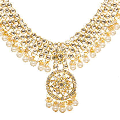 Bindhani Gold-plated kundan necklace with layered stones and hanging pearl beads, white background