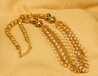 Bindhani Gold-plated multi-strand pearl necklace with meenakari beads on gold fabric background
