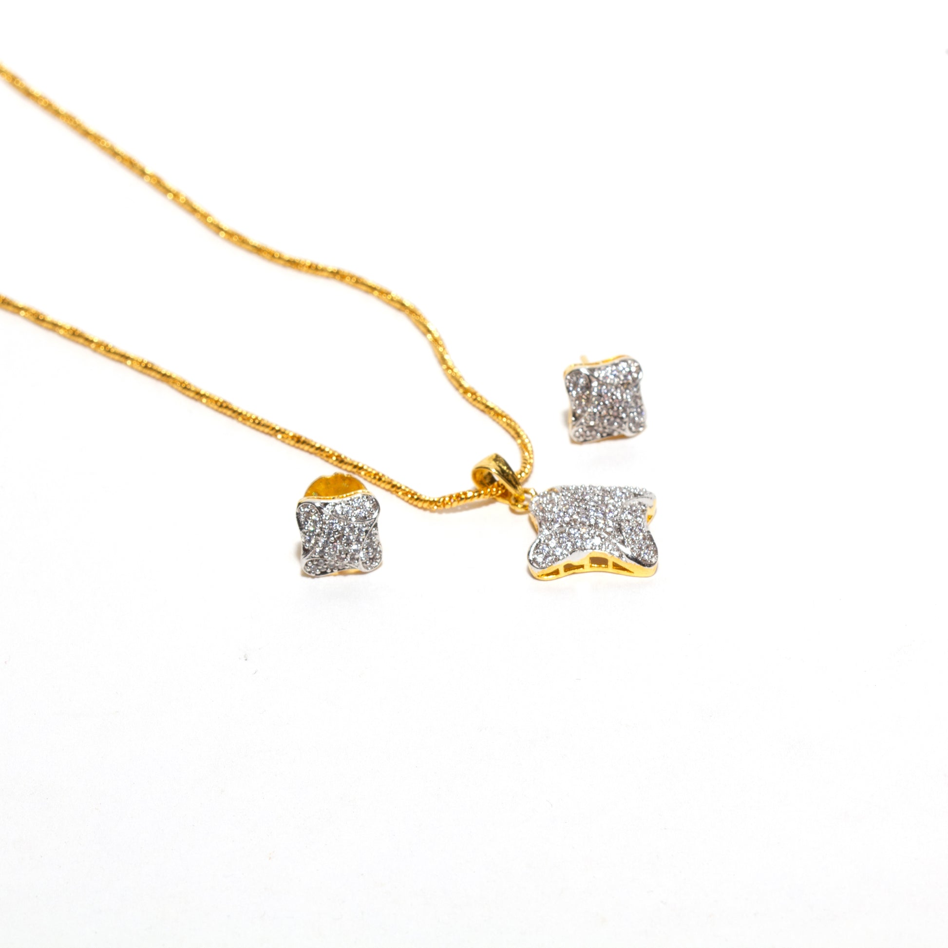 Elegant Bindhani cubic zirconia pendant set with matching small stud earrings and gold-tone chain, featuring sparkling stone detailing and graceful craftsmanship.