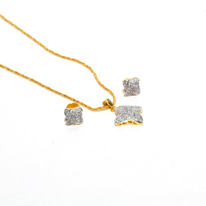 Elegant Bindhani cubic zirconia pendant set with matching small stud earrings and gold-tone chain, featuring sparkling stone detailing and graceful craftsmanship.