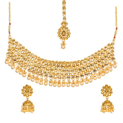 Bindhani gold-plated Kundan stone choker necklace set for women featuring white Kundan stones, layered traditional bridal design, white pearl drop accents, matching jhumka earrings, and a floral maang tikka on a white background
