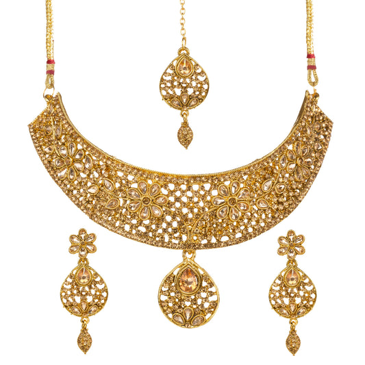 Bindhani gold-plated bridal necklace choker set for women featuring an intricate floral filigree choker design, brown sparkling stone embellishments,  statement necklace, matching floral drop earrings, and coordinating maang tikka on a white background.