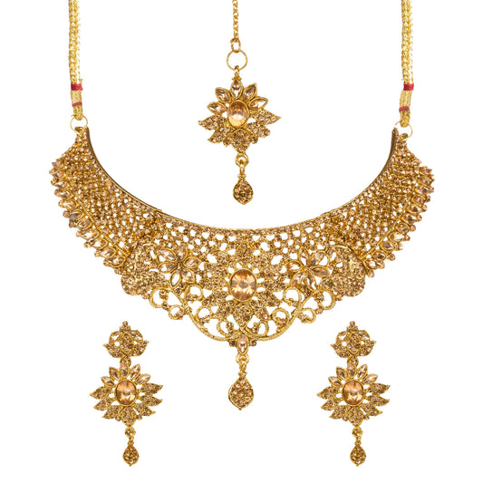 Bindhani gold-plated bridal necklace set for women featuring an intricate floral filigree choker design with sparkling stone embellishments, matching floral earrings, and a coordinating maang tikka on a white background.