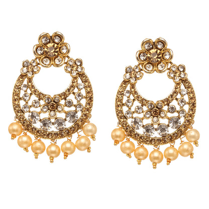 Bindhani gold-plated chandelier earrings featuring golden and white stones, floral motifs, intricate openwork detailing, circular drop design, and pearl bead drops. Displayed on a white background.