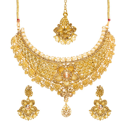 Front view of Bindhani gold-plated choker necklace featuring intricate filigree lattice detailing, a pearl border, a central floral motif with a champagne stone, geometric patterns, and a teardrop crystal pendant. Displayed on a white background.