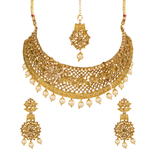 Bindhani gold-plated bridal necklace set for women featuring an intricate floral filigree choker design, sparkling stone embellishments, matching floral drop earrings, and coordinating maang tikka on a white background.