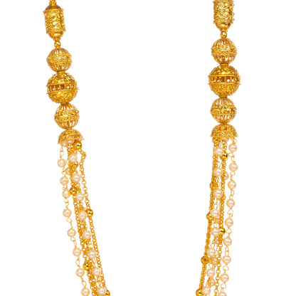 Close-up of gold-plated textured bead necklace with multiple pearl chain