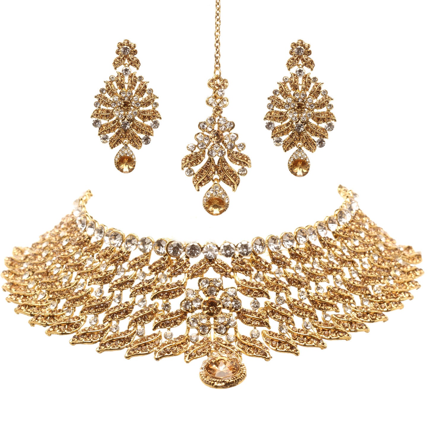 Bindhani gold-plated choker necklace set featuring champagne and white stones, layered leaf motifs, intricate openwork detailing, floral accents, and a pear-shaped drop at the center. The set includes matching statement earrings and a coordinating maang tikka with champagne and white stones, displayed on a white background.