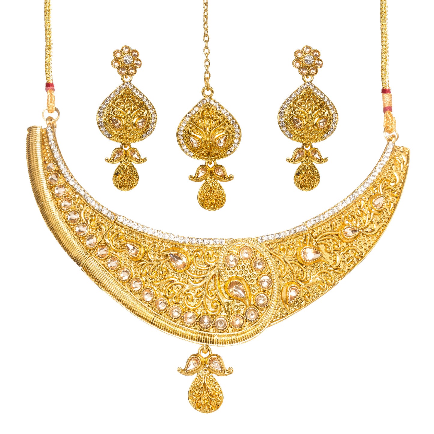 Bindhani Traditional gold plated jewelry set featuring an intricately engraved statement necklace with floral filigree, teardrop-shaped white stones, and a central paisley-inspired motif, paired with matching drop earrings and a coordinating maang tikka on a white background.