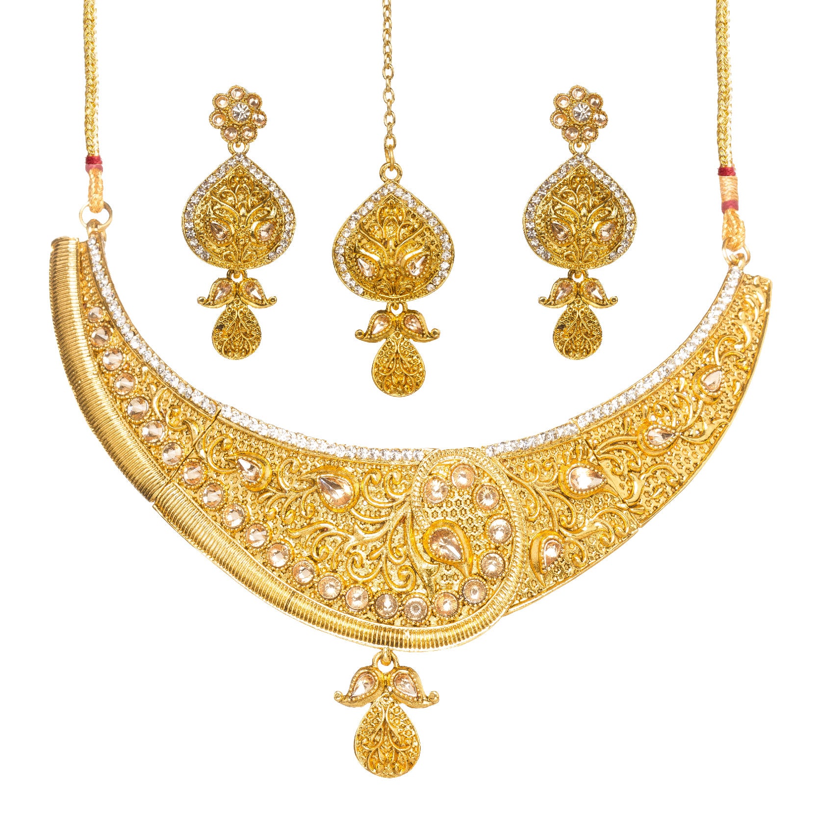 Bindhani Traditional gold plated jewelry set featuring an intricately engraved statement necklace with floral filigree, teardrop-shaped white stones, and a central paisley-inspired motif, paired with matching drop earrings and a coordinating maang tikka on a white background.
