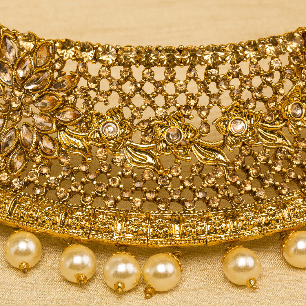 Bindhani gold-plated choker necklace set for women featuring intricate traditional design, elegant stone embellishments, golden beads detailed gold craftsmanship, a stylish bridal jewelry look on a grey background.