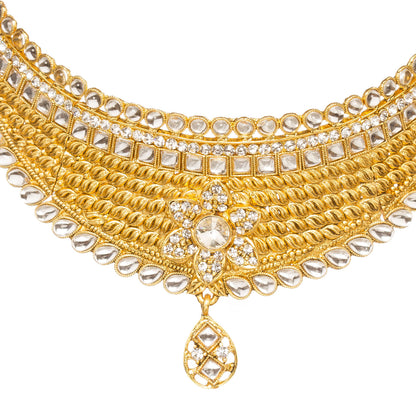 Front view of Bindhani gold-plated bridal choker necklace set featuring layered twisted gold detailing, white kundan stone border accents, floral centerpiece design,The complete jewelry set displayed on a clean white background.