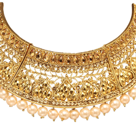 Front view of Bindhani gold-plated choker necklace featuring intricate filigree openwork, floral and leaf motifs, textured detailing, a row of teardrop-shaped accents, and pearl bead drops along the lower edge. Displayed on a white background.