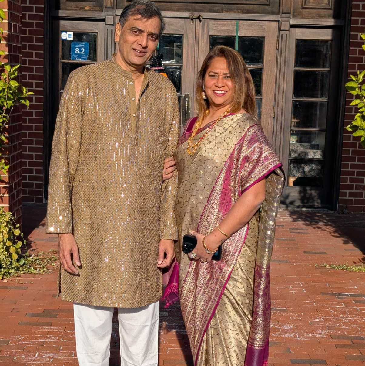 Bindhani customer holding theme, indian heritage , golden color saree and Bindhani necklace at destination wedding 