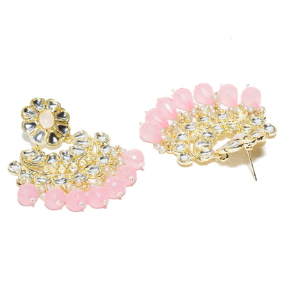 Bindhani gold-plated Kundan Chandbali earrings featuring floral baby pink stone tops, intricate white Kundan stone detailing, circular crescent-shaped design, gold-tone handcrafted work, pearl bead accents, and bright baby pink teardrop stone danglers. Traditional Indian statement earrings for women on a front and back white background.