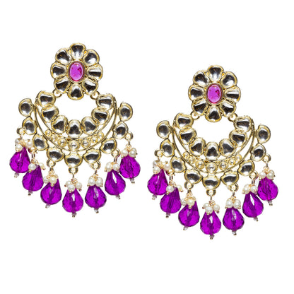Bindhani gold-plated Kundan Chandbali earrings featuring floral purple stone tops, intricate white Kundan stone detailing, circular crescent-shaped design, gold-tone handcrafted work, pearl bead accents, and bright purple teardrop stone danglers. Traditional Indian statement earrings for women on a white background.