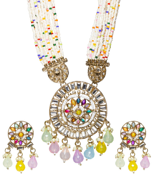 Long traditional Bindhani-inspired rani haar necklace set featuring multiple strands of white seed beads with multicolor accent beads. The statement pendant is circular with intricate kundan stones in a radial pattern, highlighted with colorful teardrop-shaped stones in pink, blue, yellow, green, and orange. The pendant is finished with dangling pastel bead drops in mint green, lavender, blush pink, sky blue, and yellow. Matching round stud earrings and pendant design and include coordinating pastel 