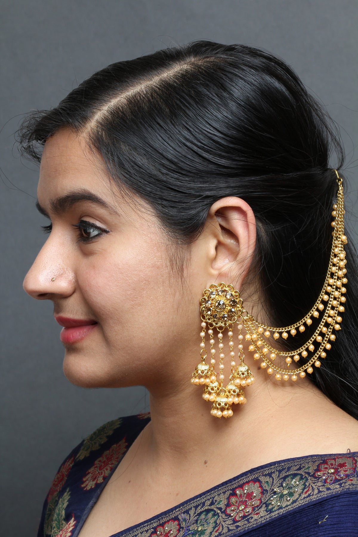 bindhani gold plated long faux pearl drop golden stone jhumki head chain bahubali earrings for women